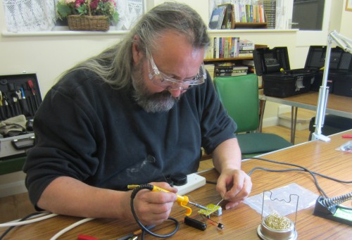 Chris G0IPU getting stuck into the soldering demo