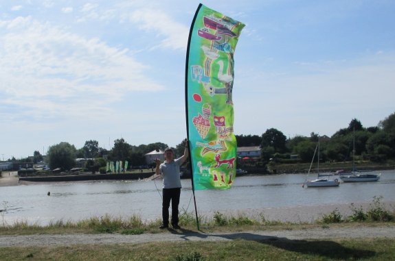 Pete M0PSX  waving to the flag-bearers on the south bank of the Crouch