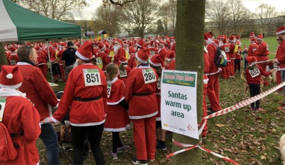 Santas warming up for the Santa Fun Run 2018