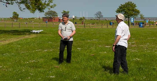 Pete M0PSX demoing  the Essex Ham quadcopter to Trevor M5AKA